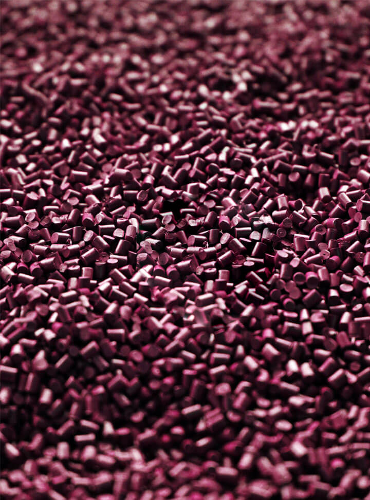 Burgundy polymer pellets made from grape waste